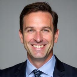 Professional headshot of Ben Carter